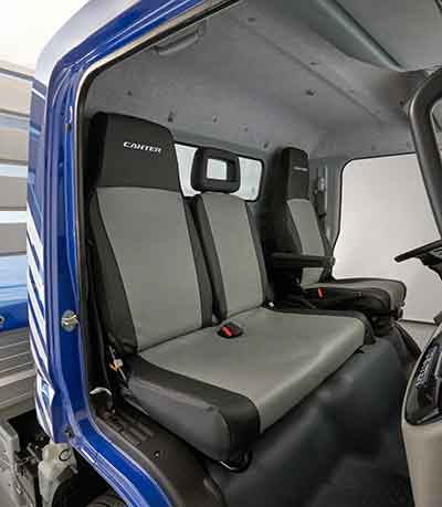 The FUSO Seat Cover is the best way to protect the interior against wear and grime. It extends the lifetime of the seats and helps to retain the value of the Canter by giving the truck a high-quality appearance.  The FUSO Seat Cover “VINYL” provides a perfect protection against dirt as well as being oil- and stain resistant. This variant is perfect for drivers working at construction sides or as gardeners.